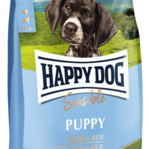 Happy dog puppy lam og ris